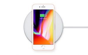 The iPhone 8 in an AirPower wireless charging mat.