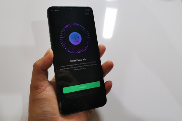 Face recognition enrollment screen on the Realme 5i.