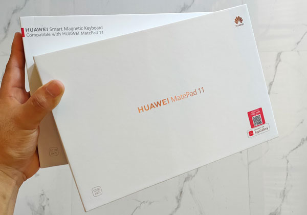 The Huawei MatePad 11 and magnetic keyboard boxes.