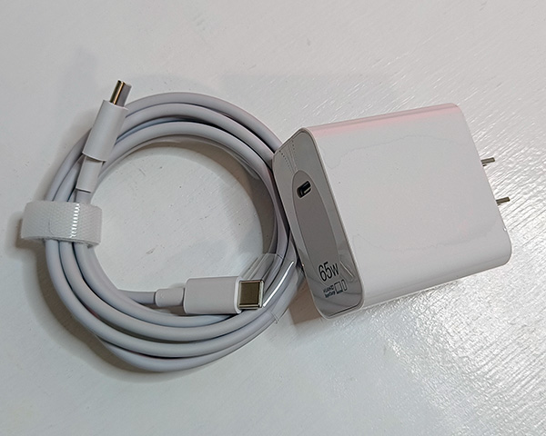 Huawei MateBook D16 65W charger and cable.