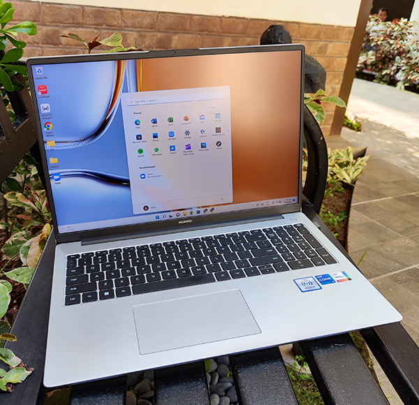 The Huawei MateBook D16 in an outdoor setting.