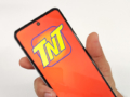 A smartphone with the TNT logo.