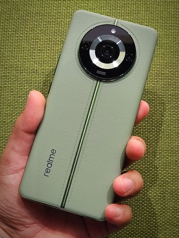The realme 11 Pro+ 5G in Oasis Green color.
