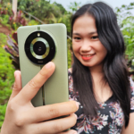 Taking a selfie with the realme 11 Pro+ 5G smartphone.