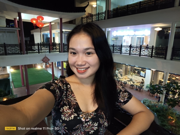 realme 11 Pro+ 5G sample selfie in low light.