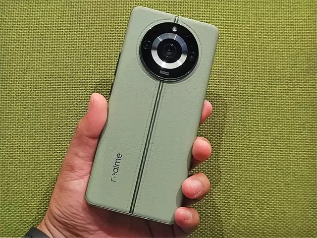 The realme 11 Pro+ 5G smartphone in Oasis Green color.
