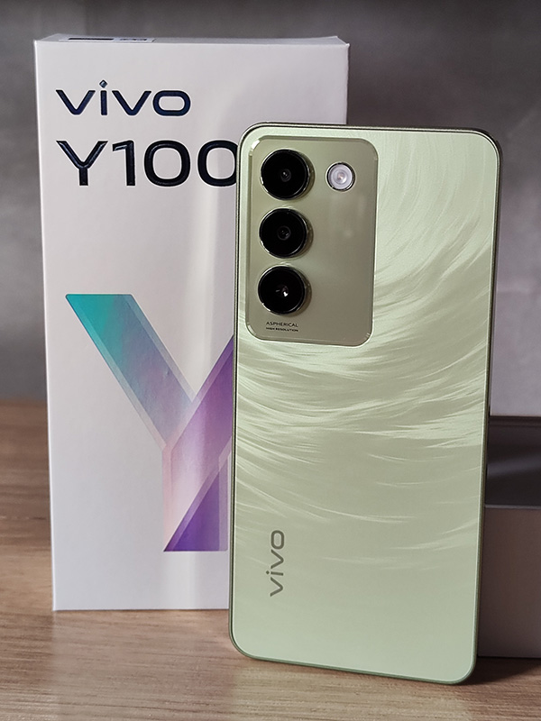 The vivo Y100 smartphone and its box.
